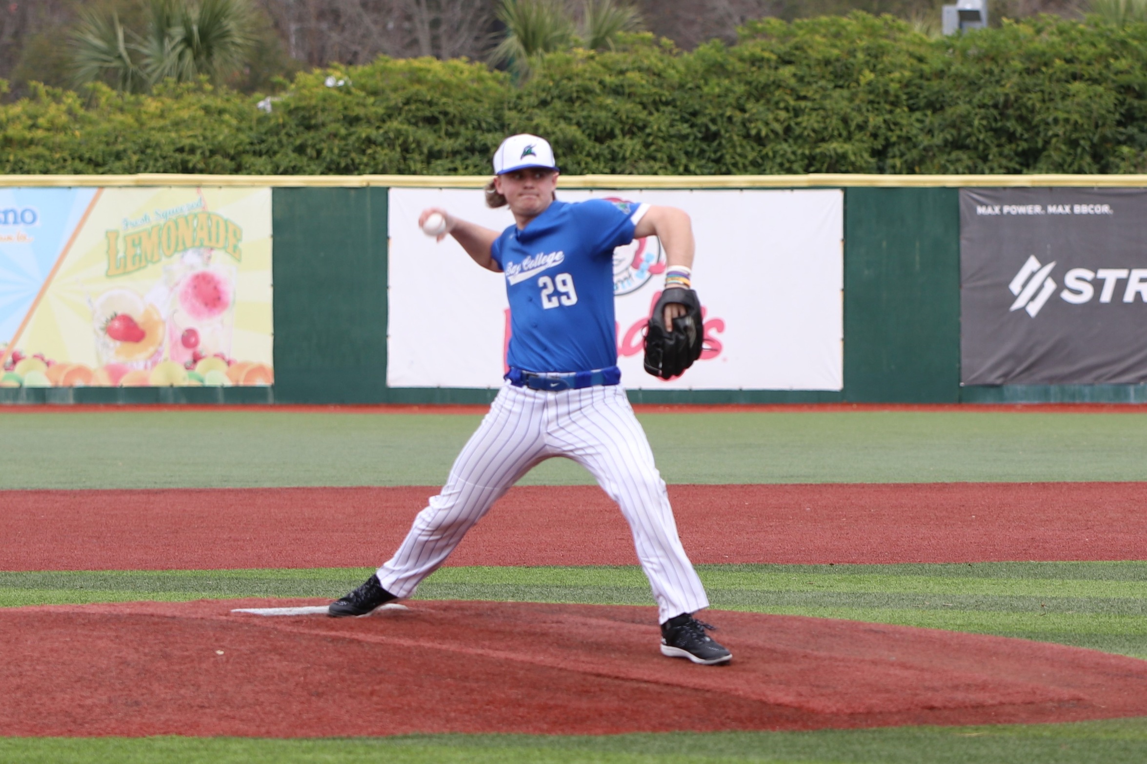 Hunter Ballantyne striding forward in his pitching motion