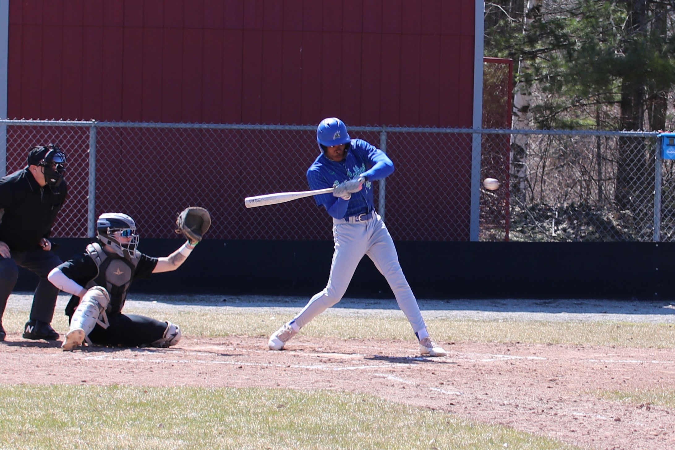Zach Gibson in mid swing as the ball comes in, the swing would result in a single
