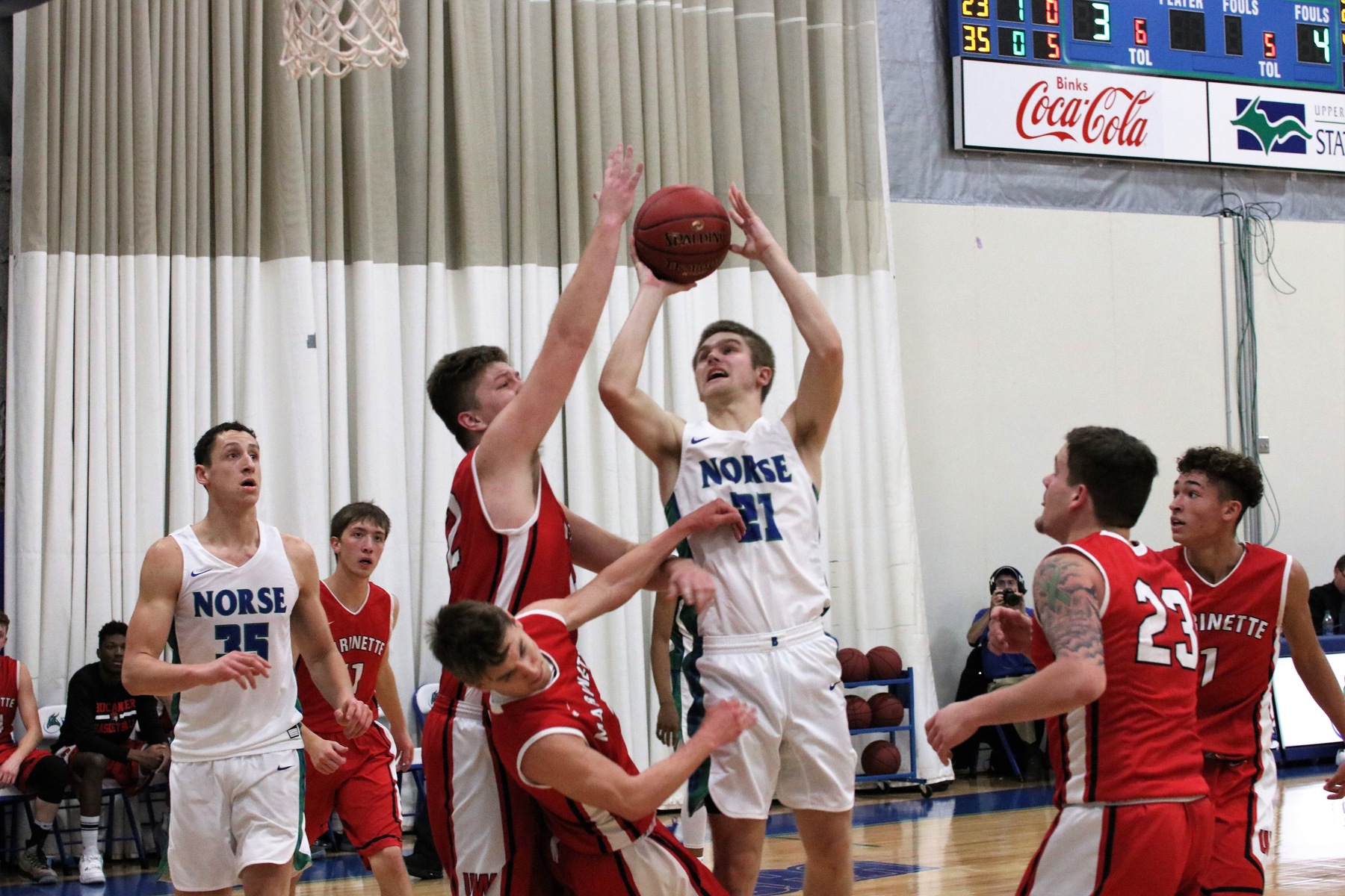 Tyler Willette shooting a jumper in the lane with four defenders in close proximity