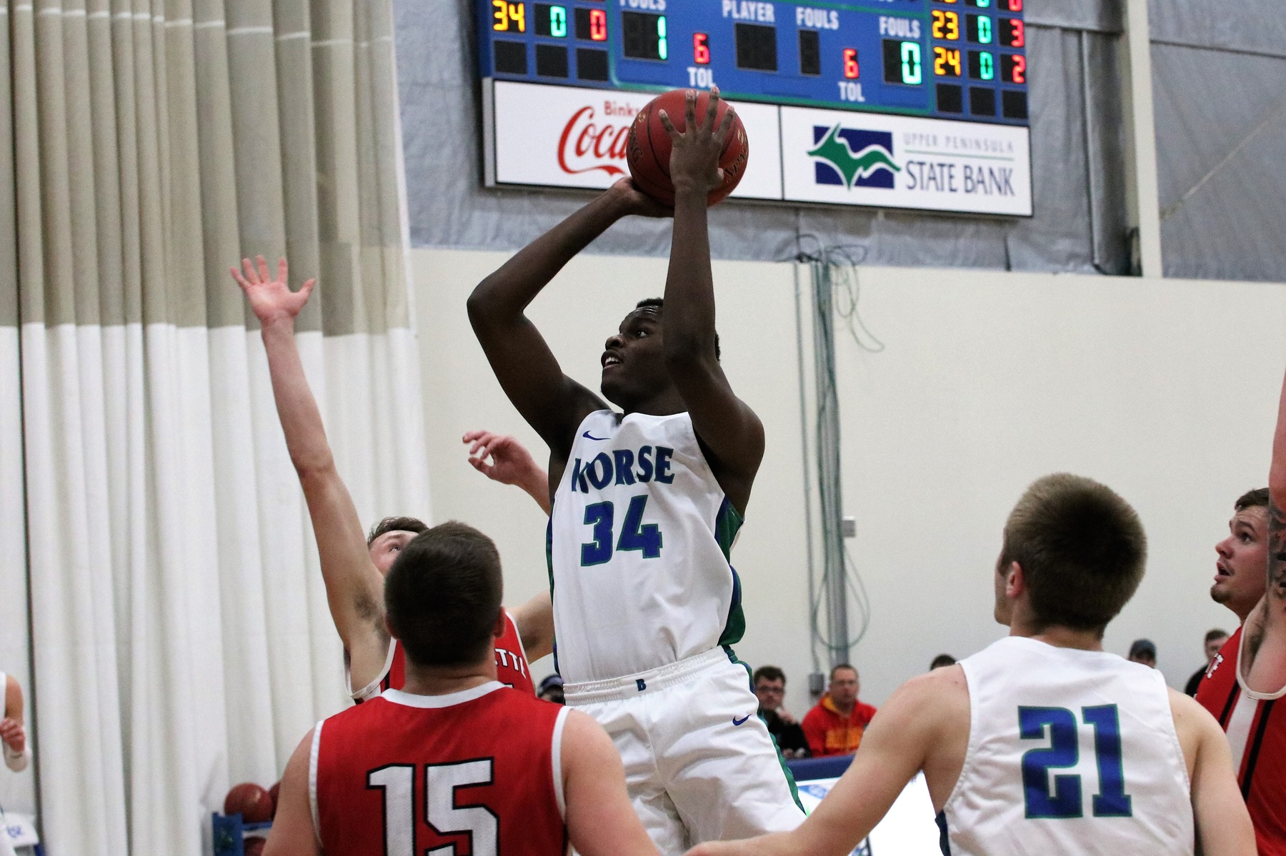 Kobi Barnes lifts over a group of players to shoot a shot