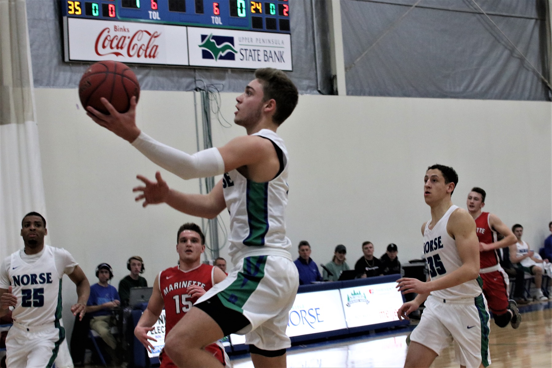 Ryan Robinette shoots a layup from the left side