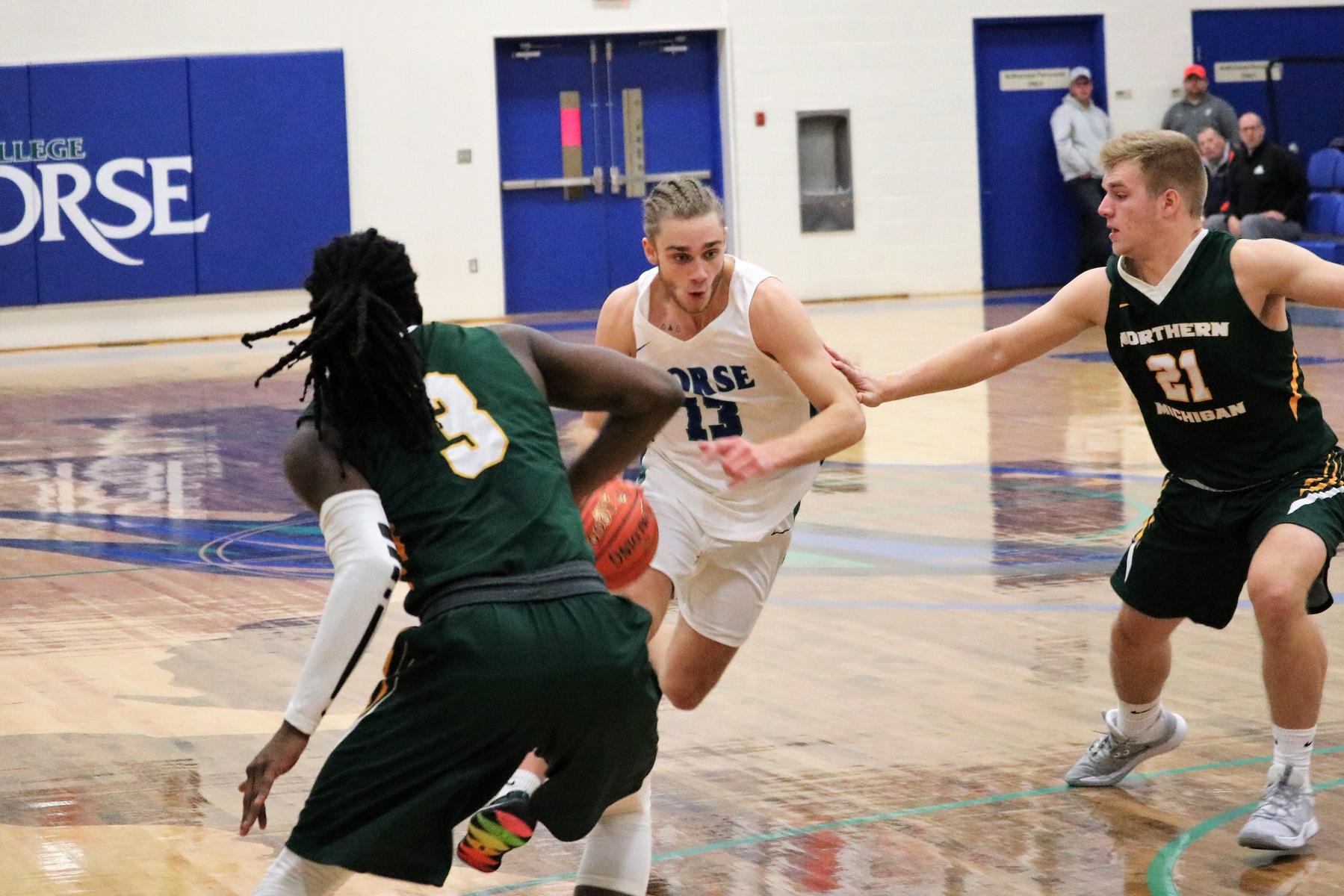 Ryan Robinette dribbles between two defenders