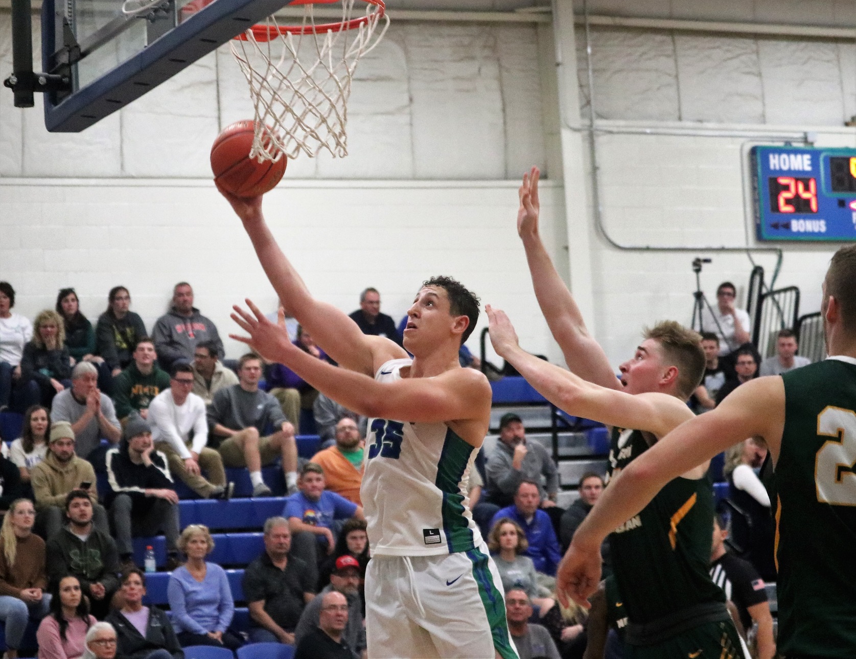 Christian Alexander shooting a layup