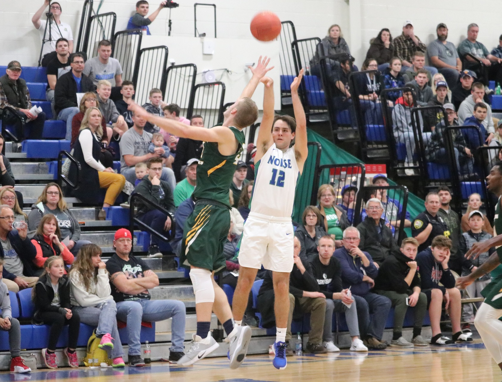 Matt Wagner shooting a three over a defender
