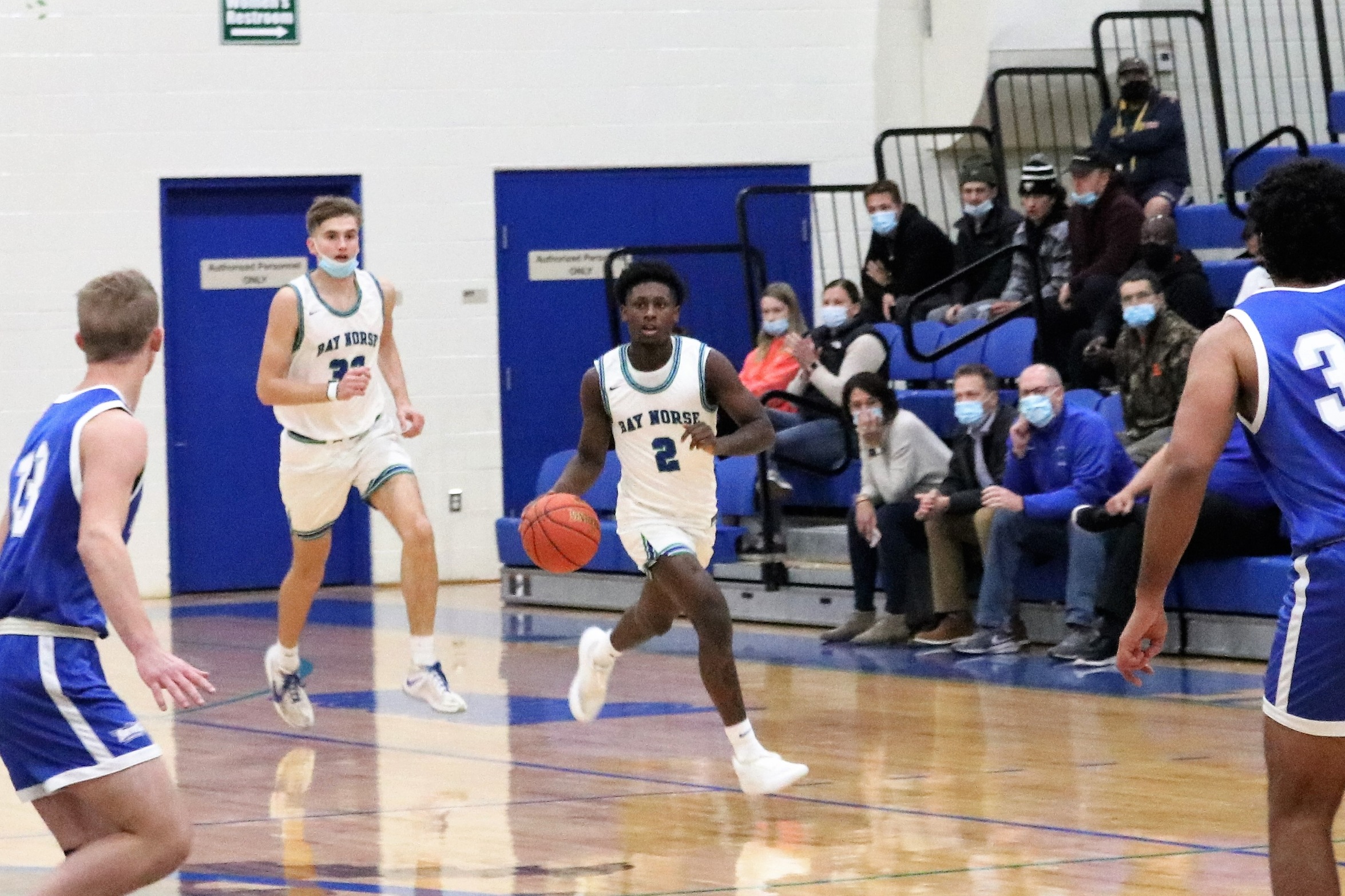 DeWayne Thompson dribbles the ball up the couart