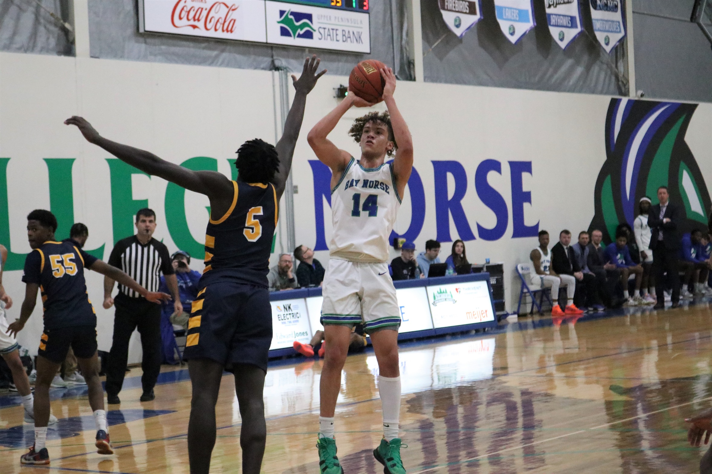 Tyrel Creger going up to shoot a shot as a defender closes in