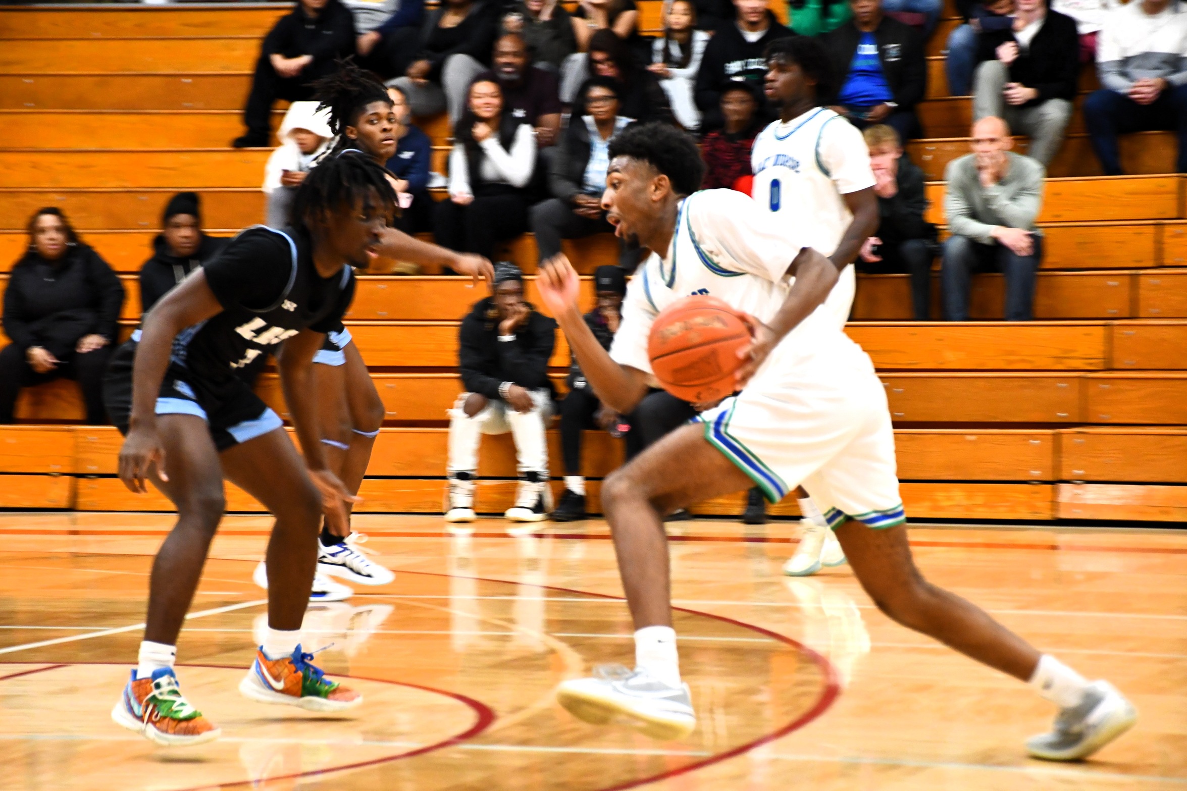 Nic Williams tries to dribble past a defender