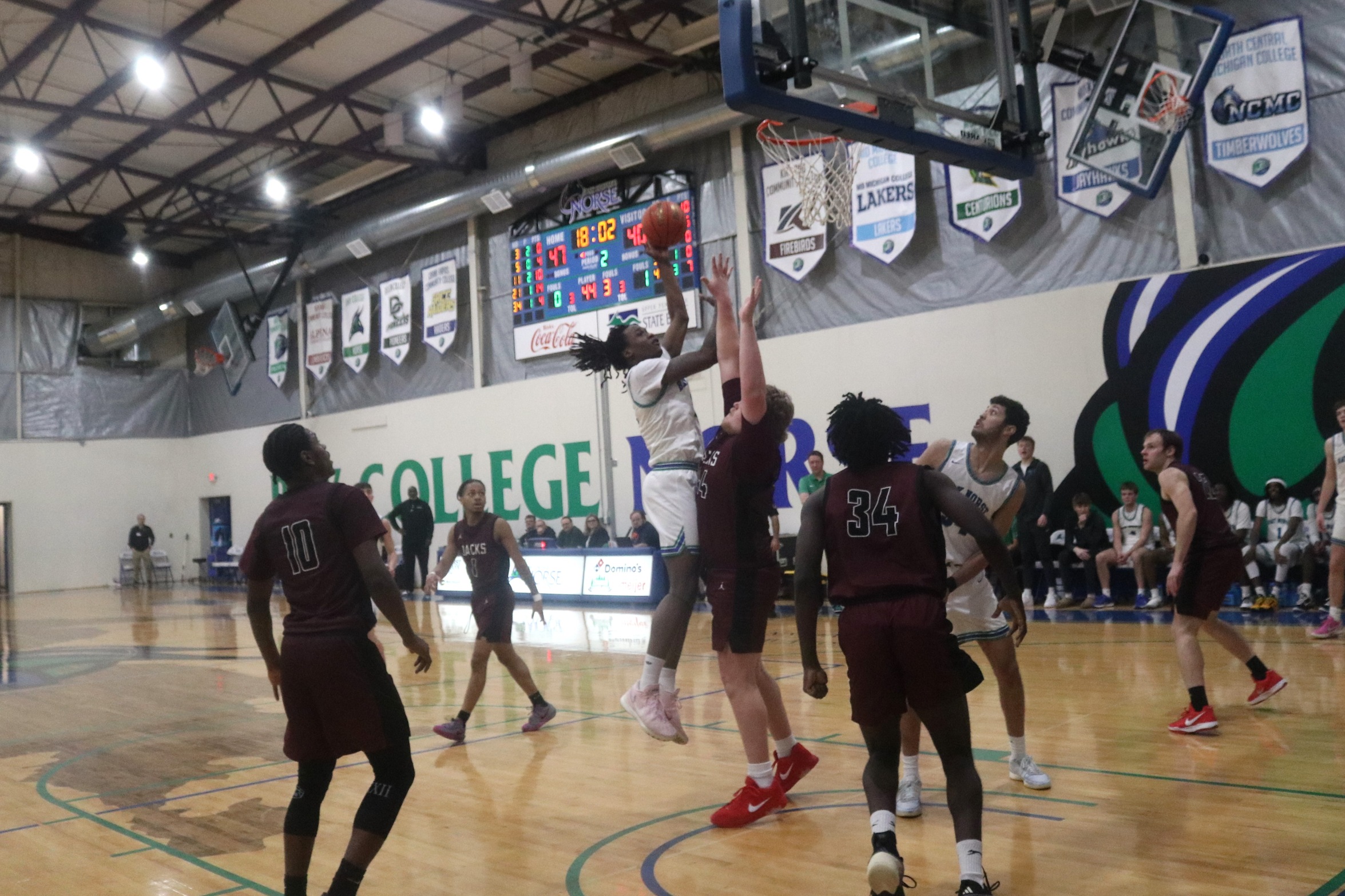 Taveon Vann puts up a shot in the lane as a defender tries to contest it