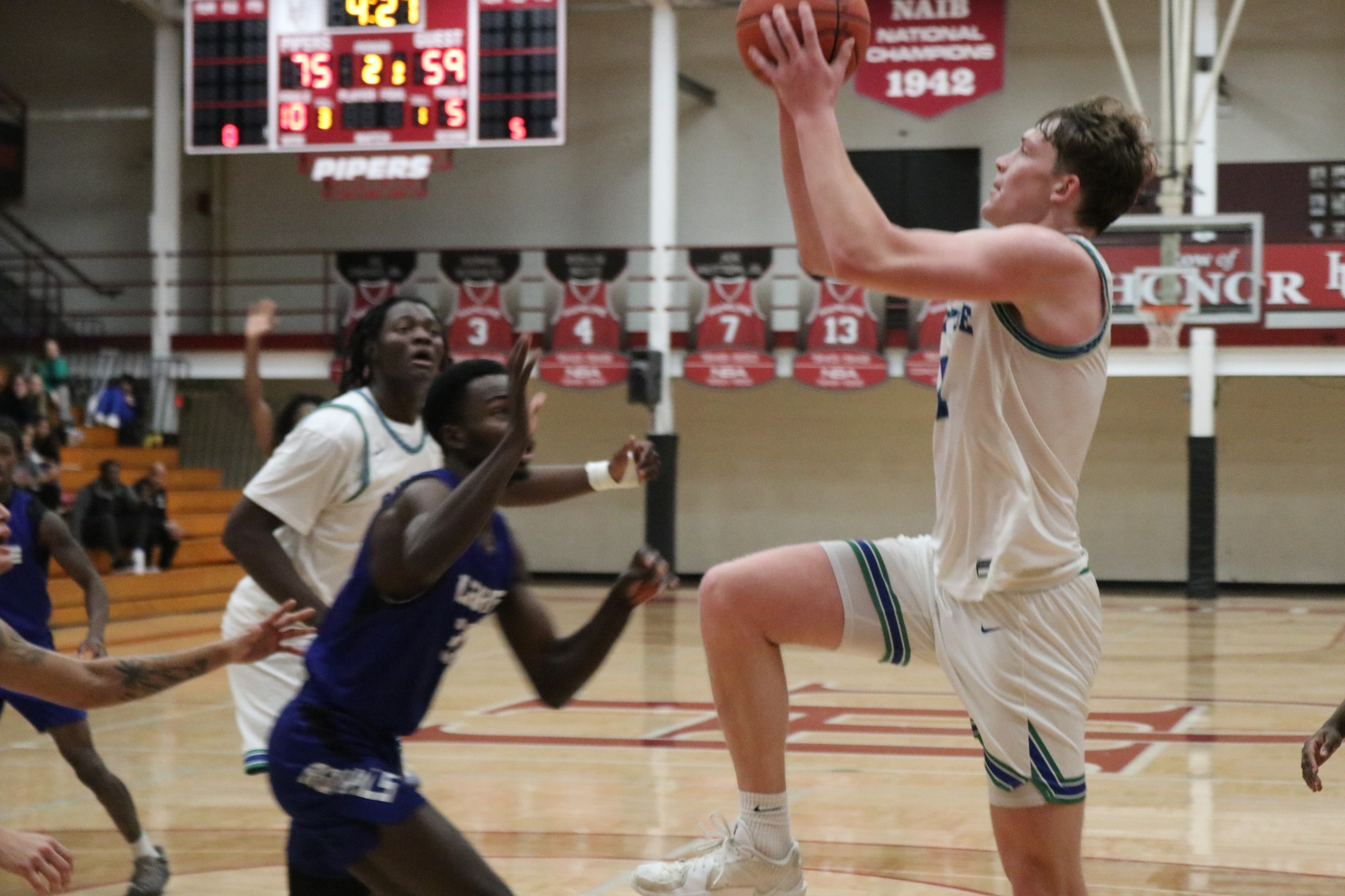 Emerson Droubie goes up for a layup as a defender closes in