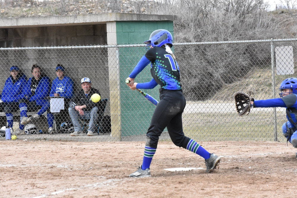 Claire McInerney in mid swing, about to make contact with the ptich