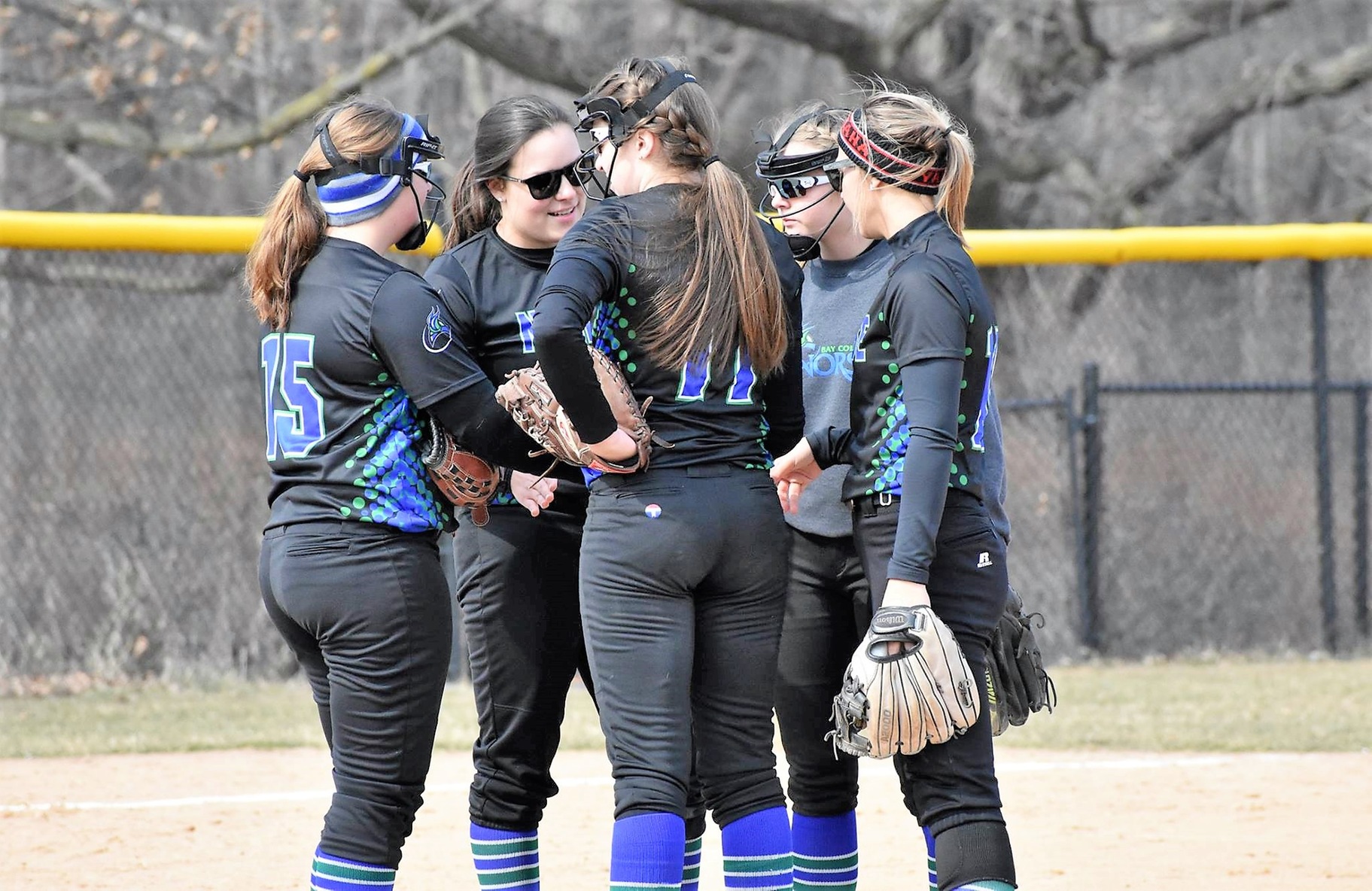 Several players meet on the mound
