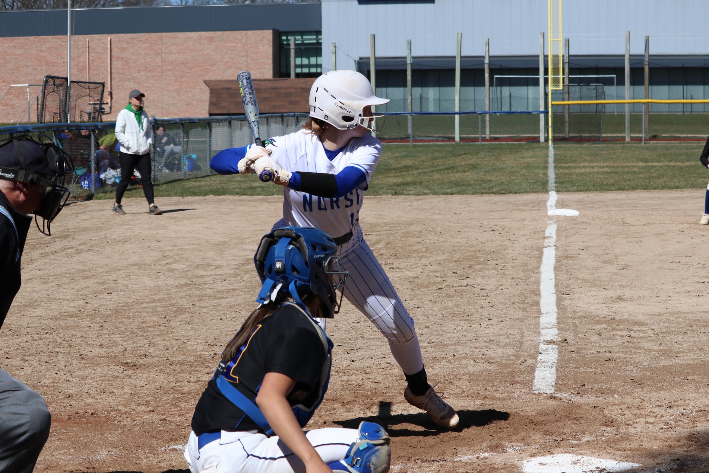 Lexie Ressiguie in the batter's box, waiting for a pitch