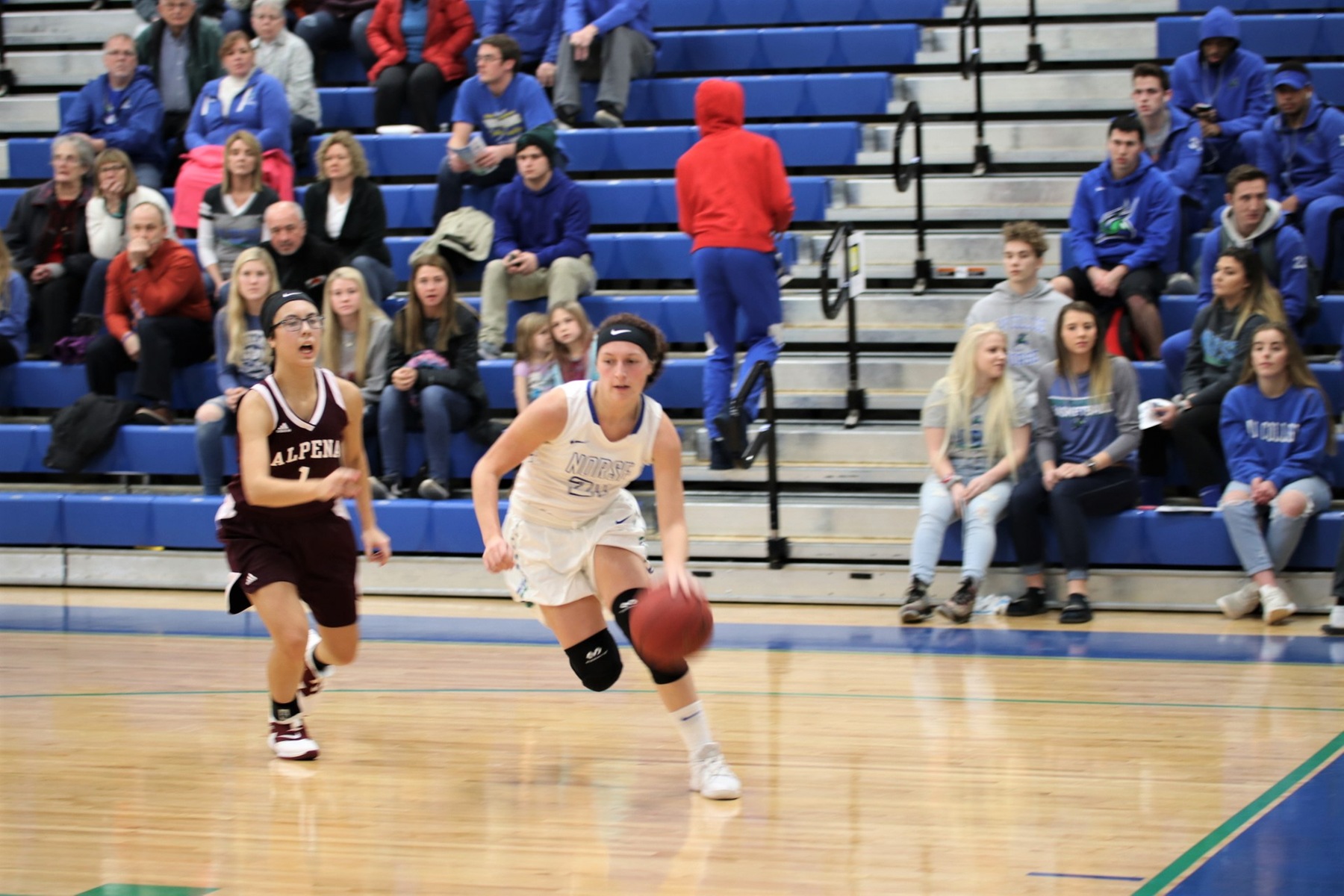 Jordan Kraemer beating her defender off the dribble to her left along the base line