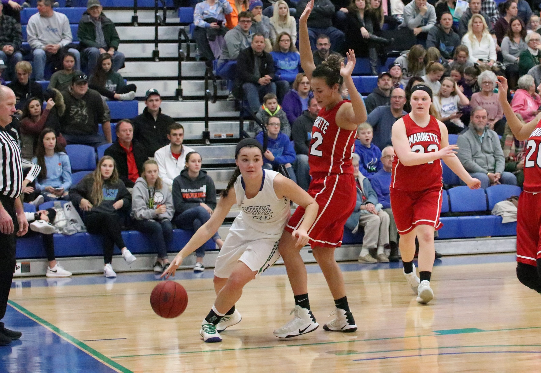 Taylor Hunter dribbling around her defender on the base line