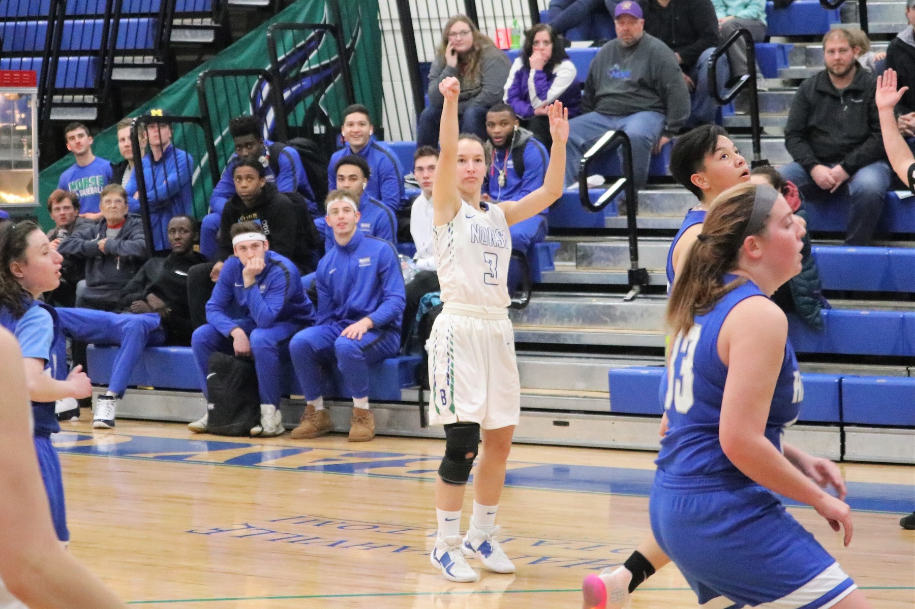 Kelsea Ackerman watching her three-point shot with her shooting arm still in the air