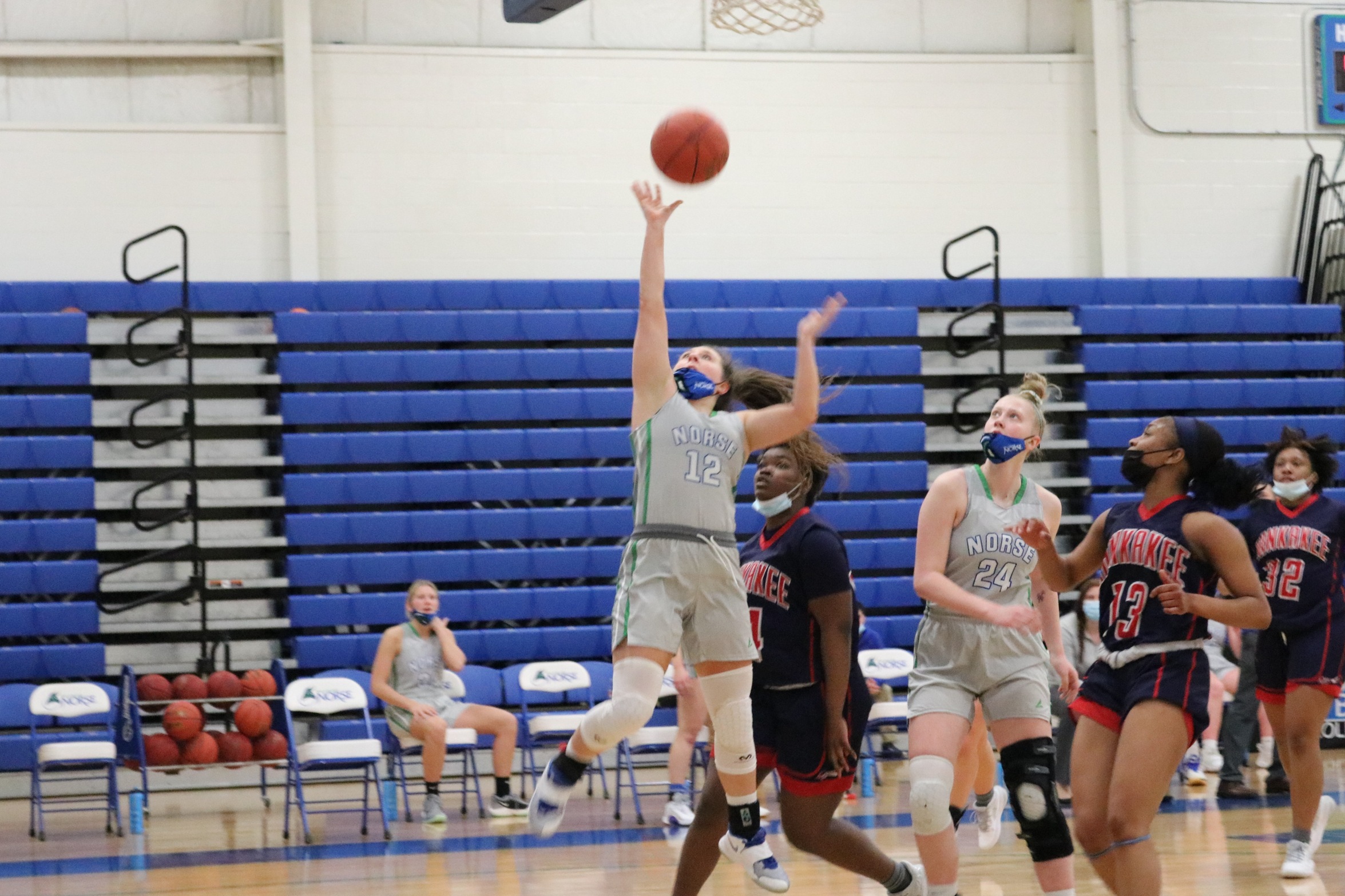 Cierra Molina in mid-air releasing a layup attempt