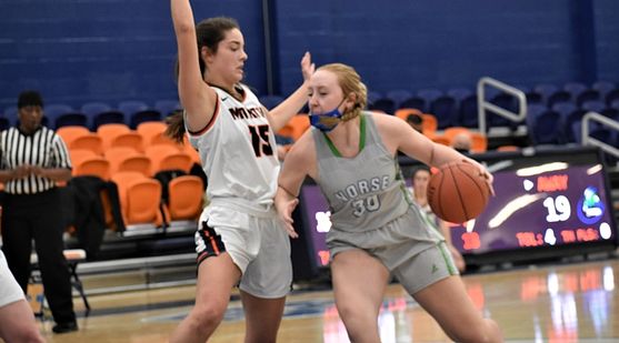 Sandra Boulton makes a move baseline with a defender trying to stop her