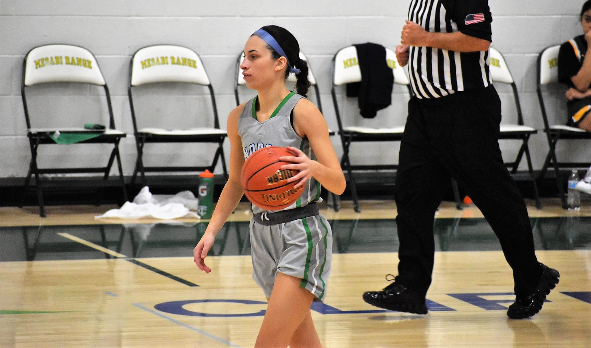 Kennedy Englund dribbling the ball up the floor.