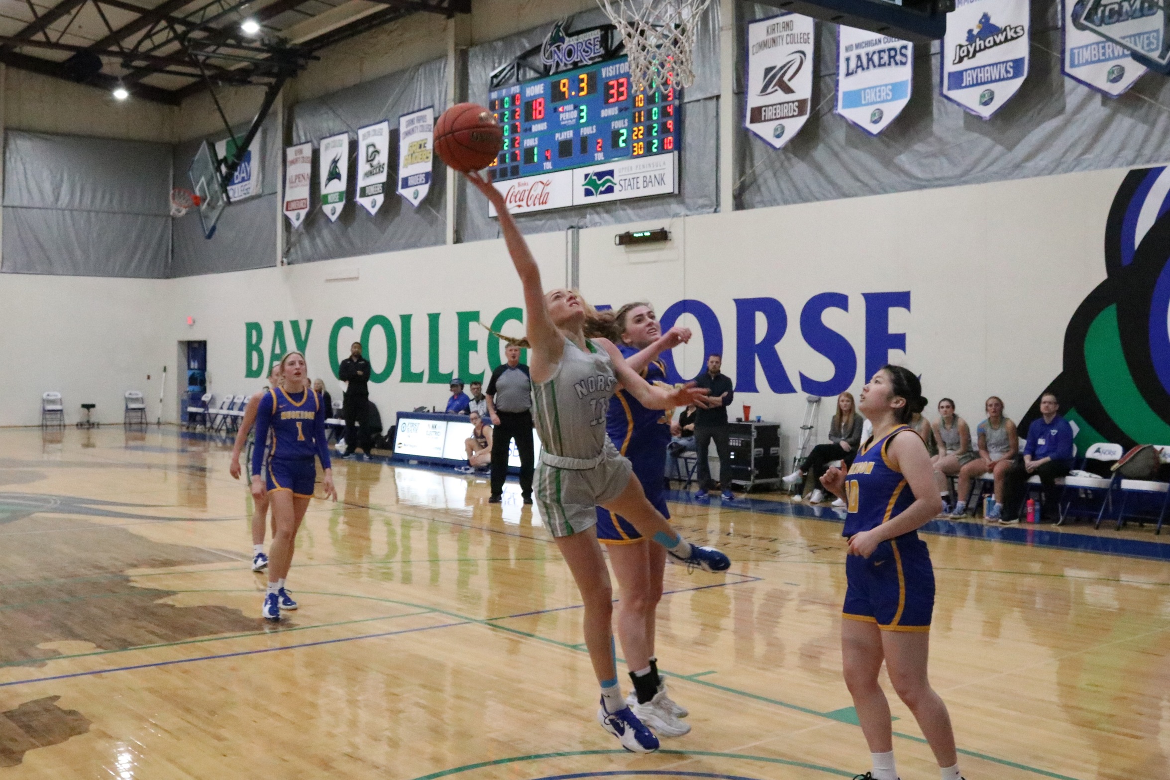 Alyssa Cretton releases a shot in the lane, having been fouled from behind