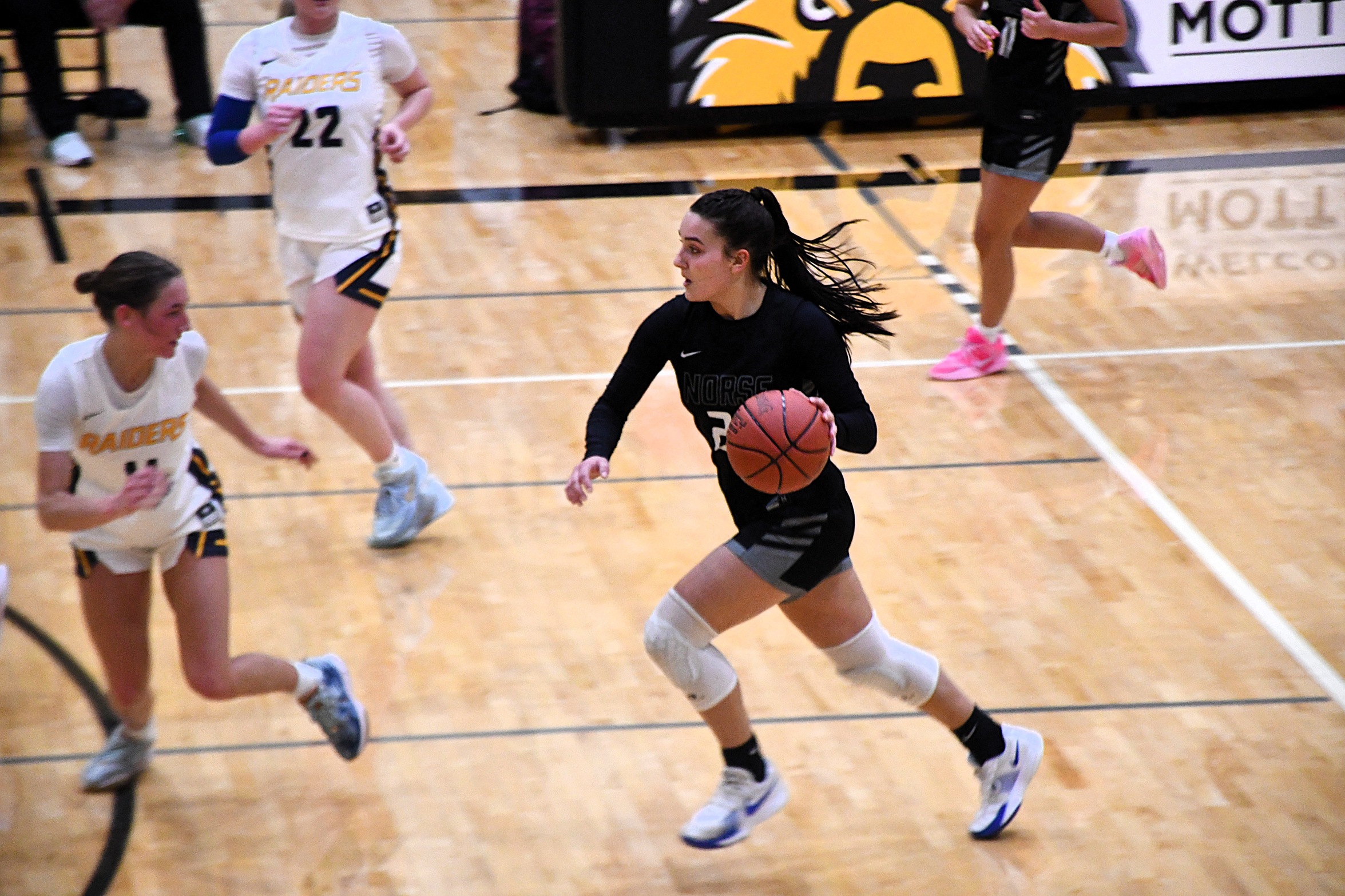 Lauren Zawada dribbles the ball up the floor