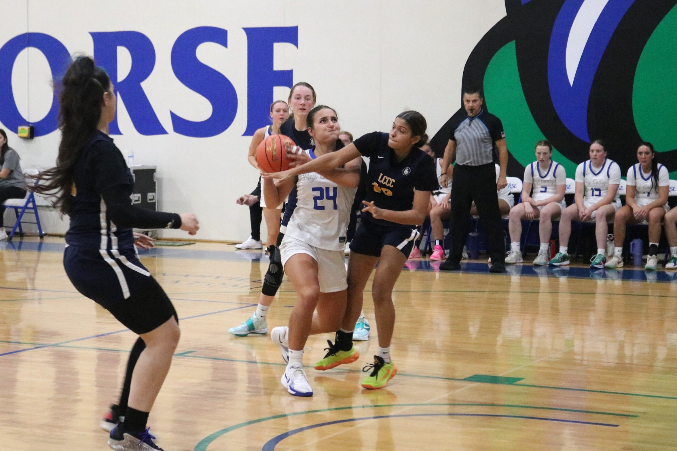 Lauren Zawada drives into the lane with defenders around her