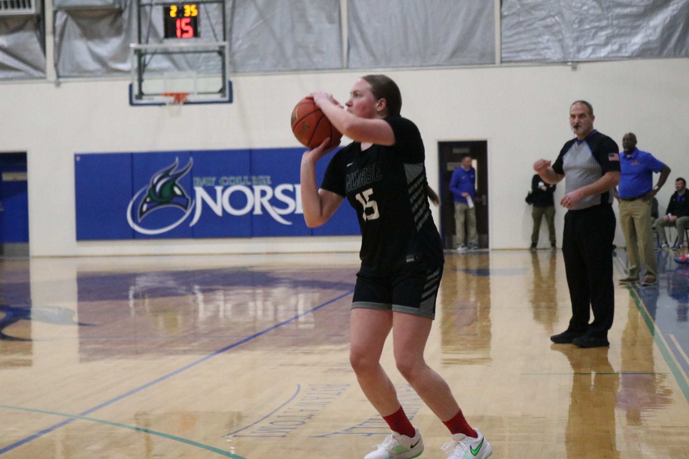 Nina Bower about to release a three-point attempt