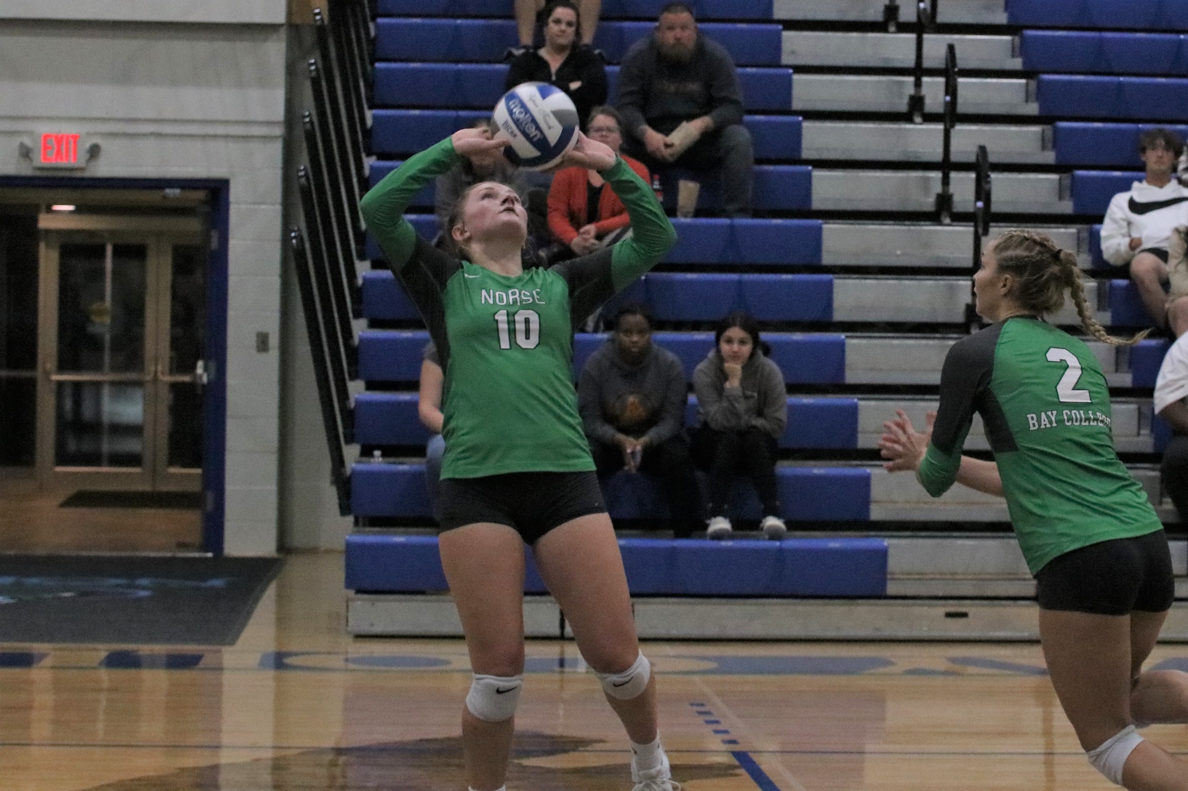 Amber Caylor concentrates on the ball as she is about to release a set.