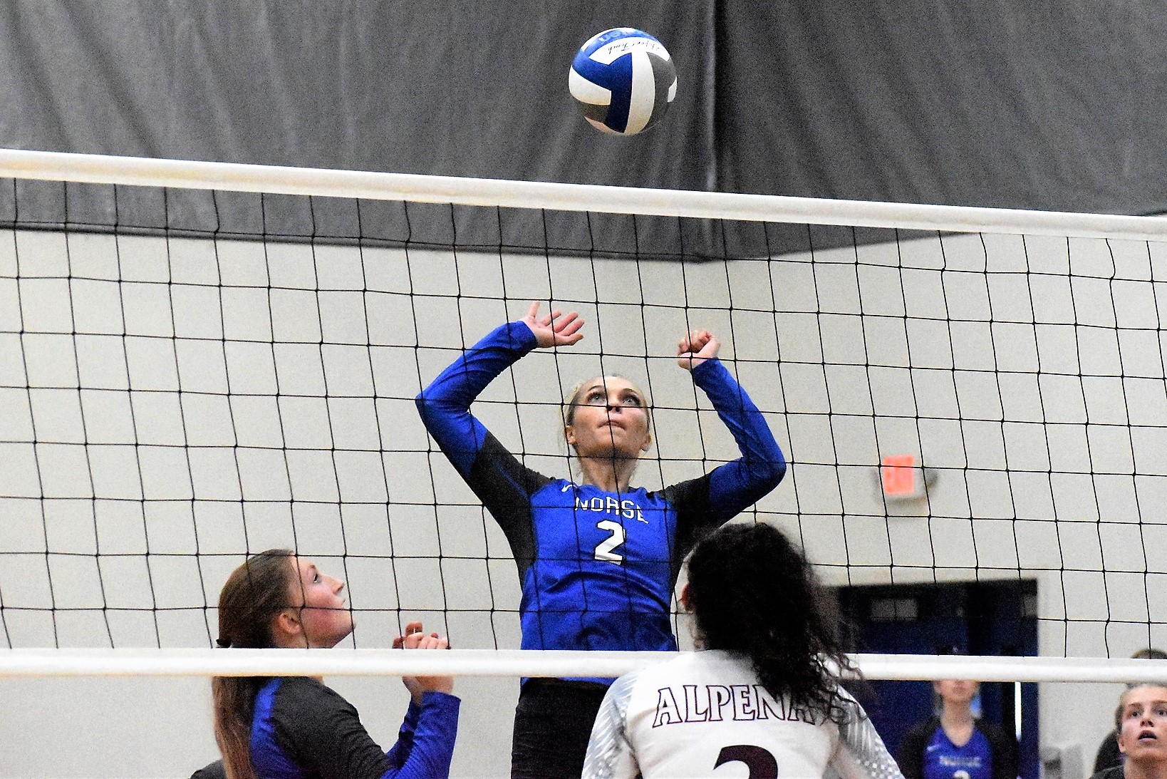 Riley Johnson rising up, about to attempt a kill