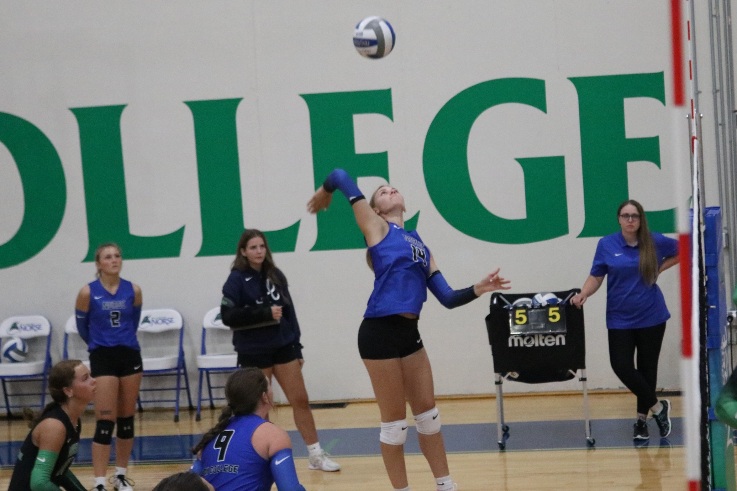 Addie Morton in mid air, swinging at the ball for a potential kill